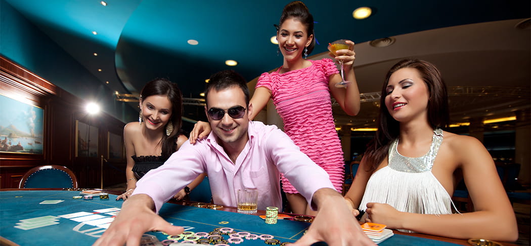 A groupe of people playing cards.