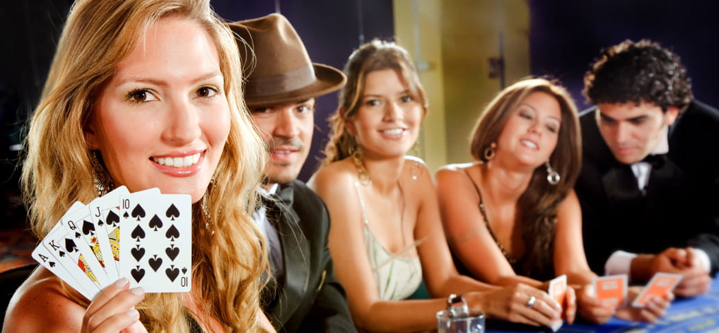 A woman shows a royal flush when playing poker.