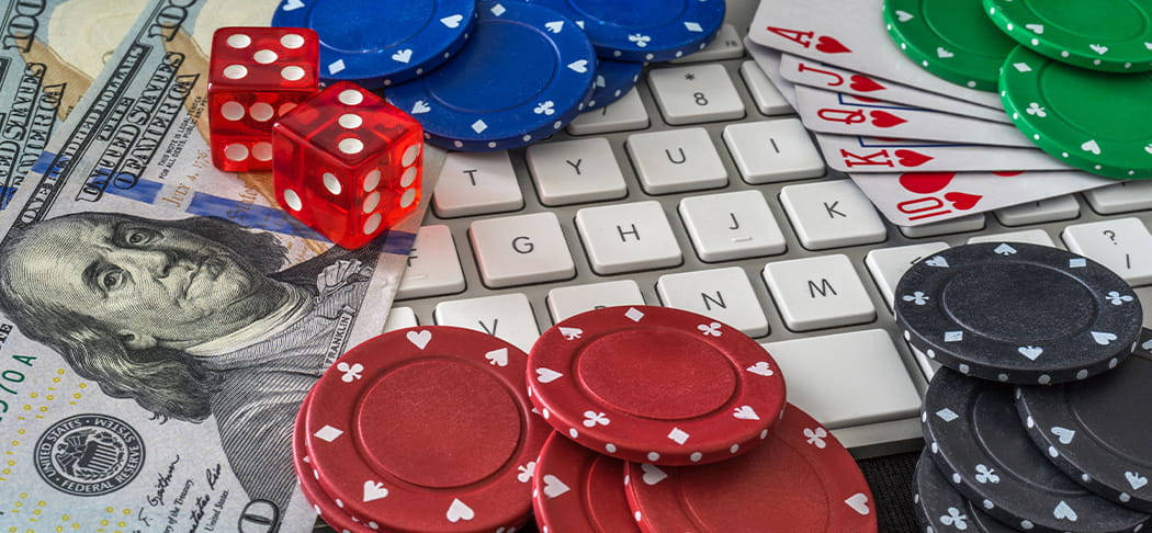 Playing cards and poker chips on a keyboard.