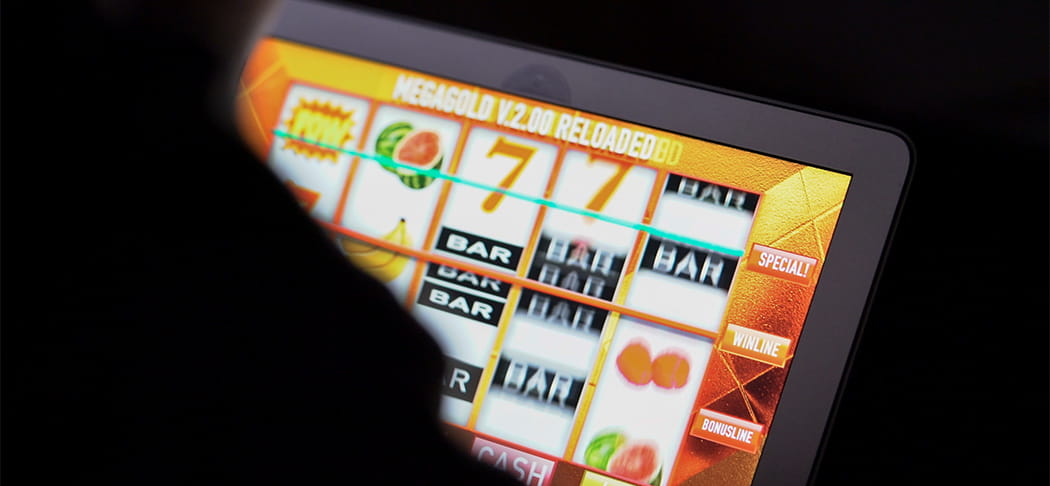 An online slot machine on a tablet.