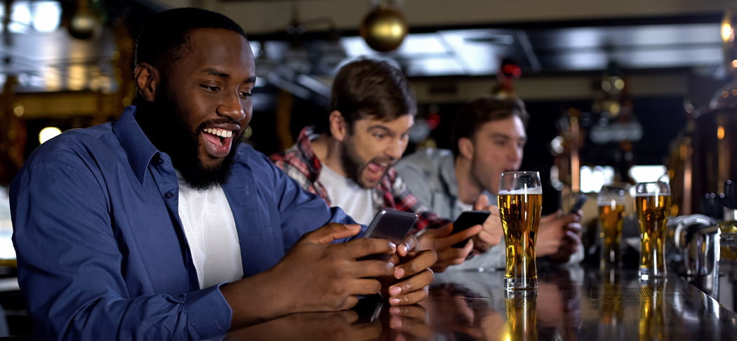 A man celebrates a sports bet win.