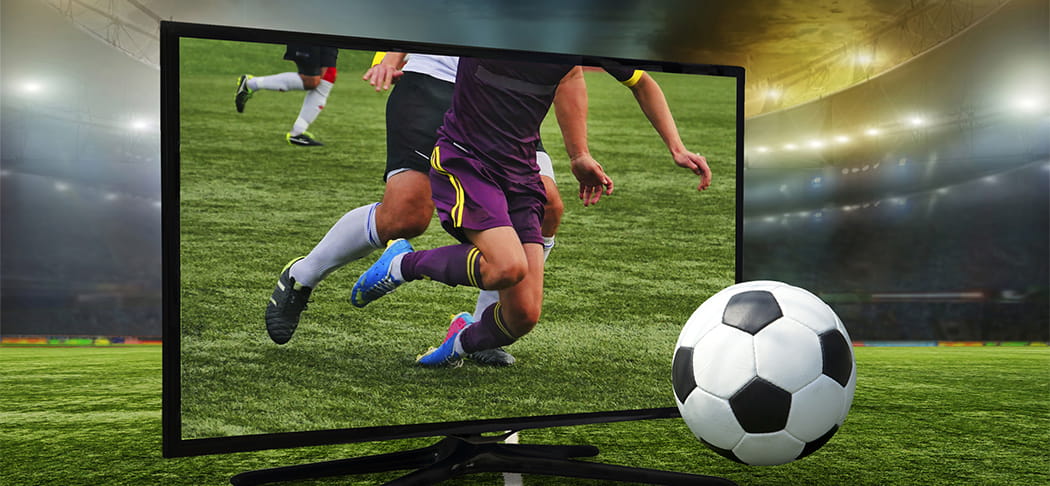A game of soccer on a TV.